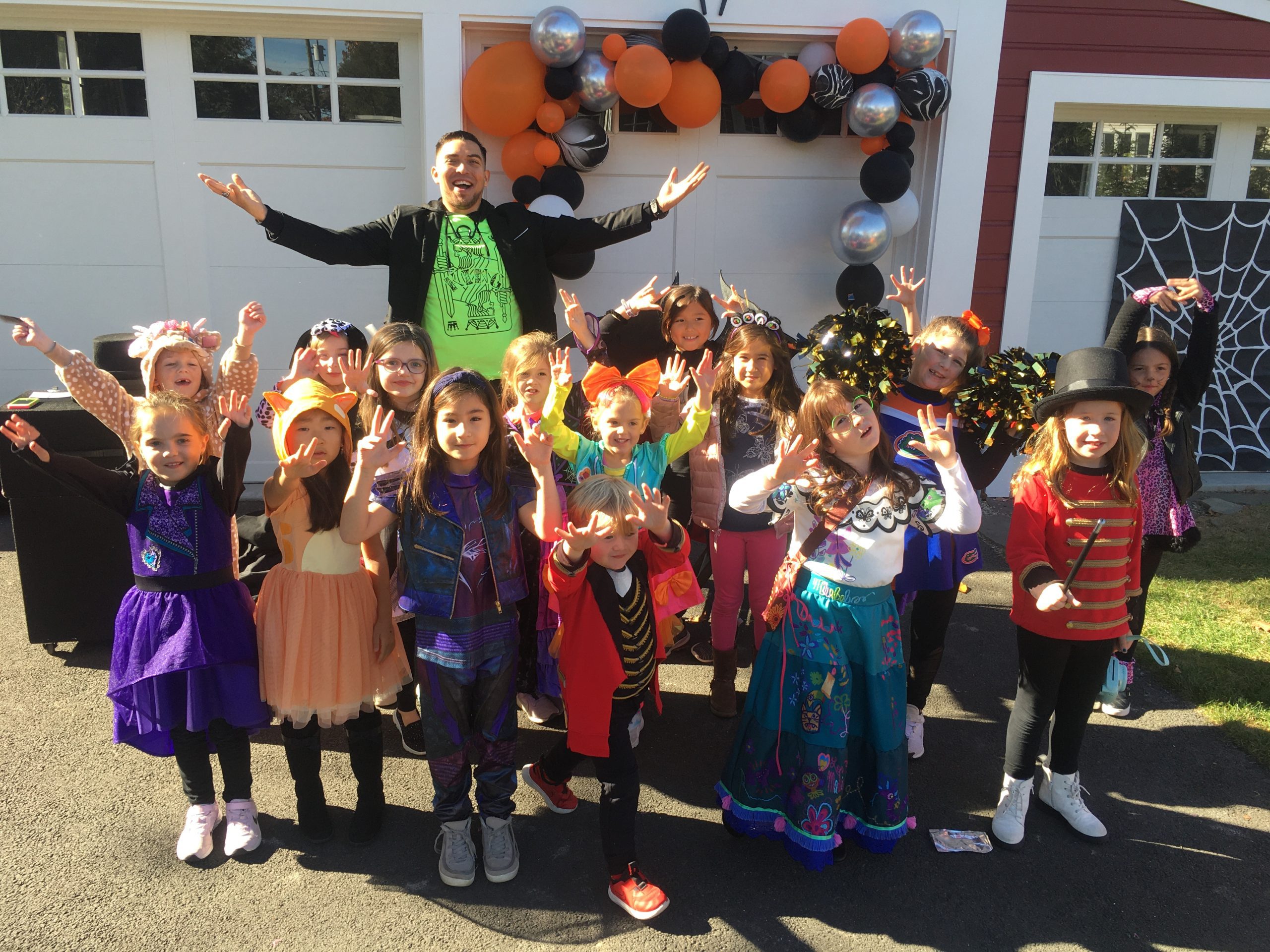 A Halloween party group cheering